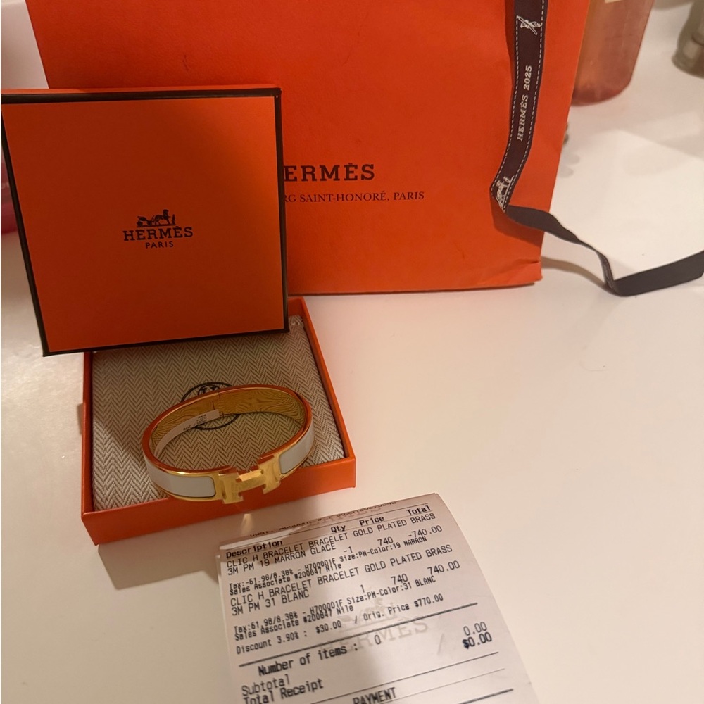 Hermes Gold and White Bracelet brand new never worn with receipt.